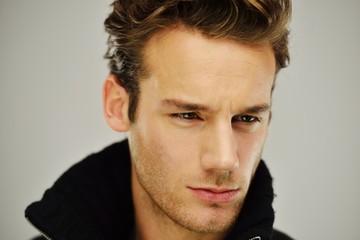 Fototapeta premium Young man studio shoot posing closeup