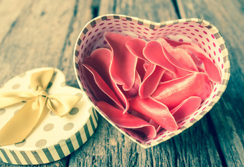 Heart shaped gift box with flower.