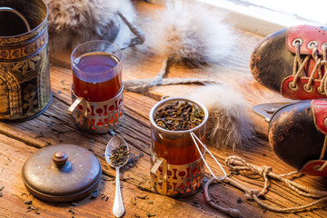 Warm leaf tea served in old-style
