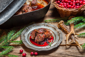 Roast venison straight from the hunt with cranberry sauce