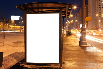 Blank sign at bus stop in city