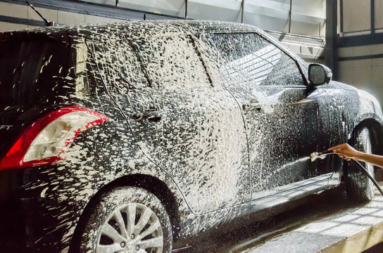 washing car by foam soap car wash