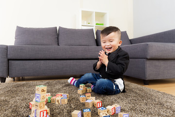 Asian kid playing toy block