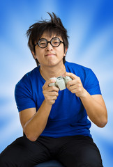 Man playing video game over blue background