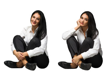 Happy and sad business women sitting against grey background