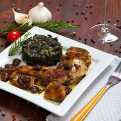 baked rabbit with vegetables in a dish