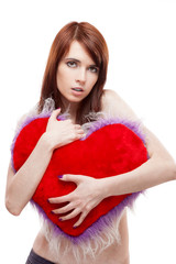 girl holding fur red heart