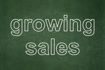 Business concept: Growing Sales on chalkboard background