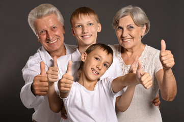 Fun family with thumbs up