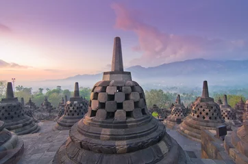 Fotobehang Sunrise Borobudur Temple Stupa in Yogyakarta, Java, Indonesia... © cescassawin