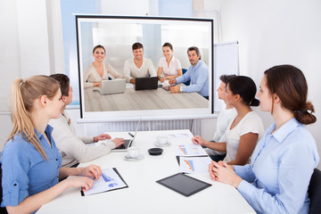 Businesspeople Attending Video Conference