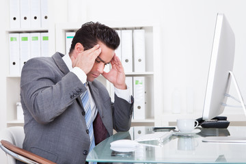 Businessman Suffering From Headache