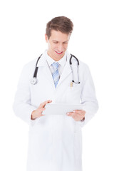 Male Doctor Using Digital Tablet Over White Background