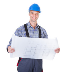 Architect Looking At Blueprint