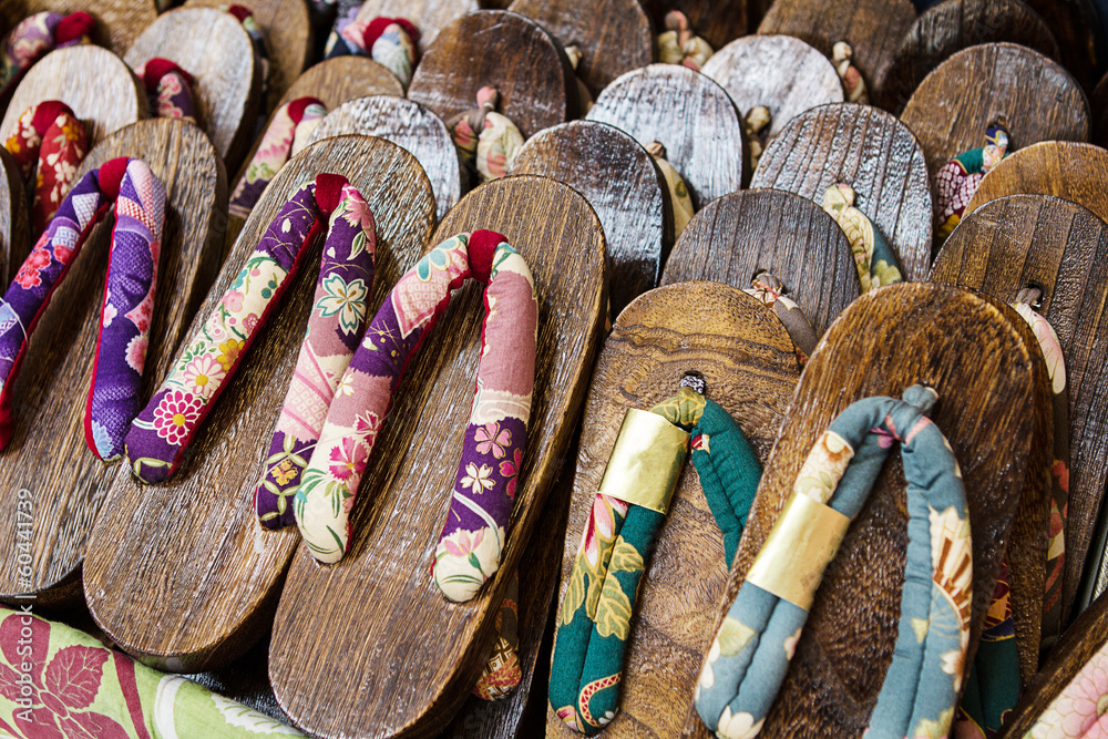 Wall mural Japanese wooden slippers on a market