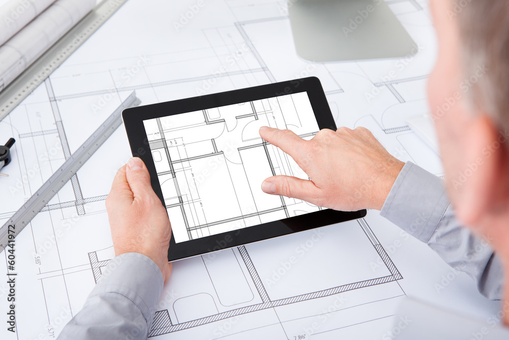 Poster architect using digital tablet