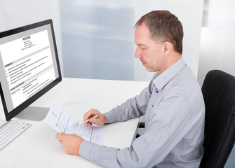Businessman Reading Resume