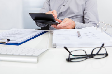 Businessman Calculating Finance