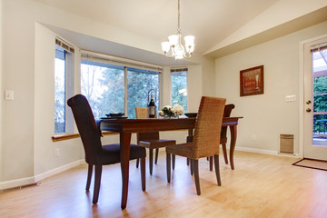 Wonderful wooden table set in a bright dining room