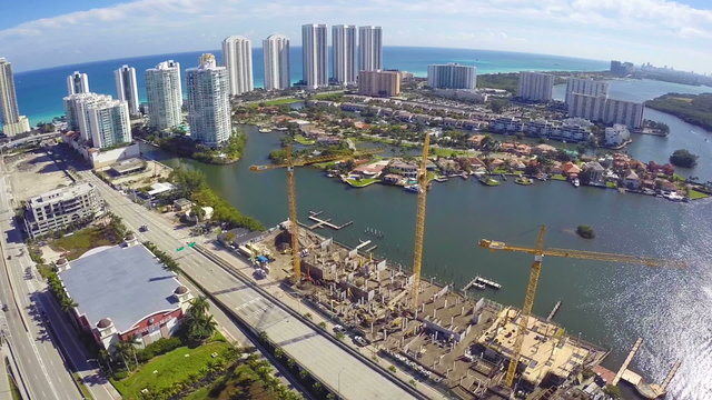 Aerial footage of construction cranes