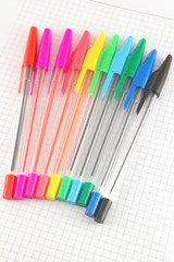 Color pen on the checked paper of notepad