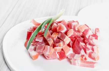 Sliced ​​bacon on a cutting board