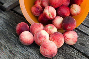 fresh peaches on wooden table