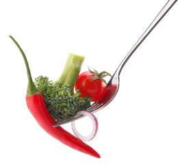 Fresh raw vegetables on fork isolated on white background cutout