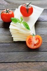 sheets of lasagna with fresh tomatoes
