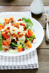fresh salad with pumpkin and greens