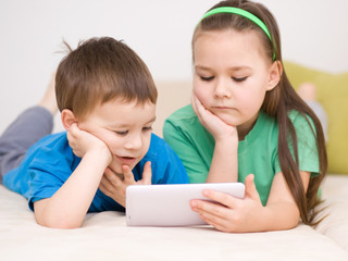 Children using tablet computer