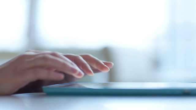 Woman typing on touchpad