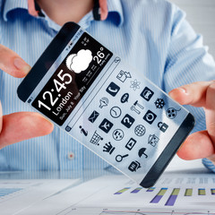 Smartphone with transparent screen in human hands.