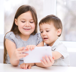 Children using tablet computer