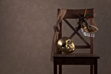 masks on  wooden chair