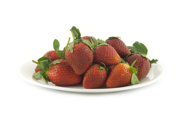 Strawberry on plate isolated over white front view closeup