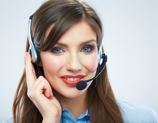 Smiling woman call center operator touching headsed. Close up b