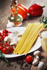 Pasta ingredients on the wooden table