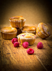 Raspberry muffins on wooden spoon