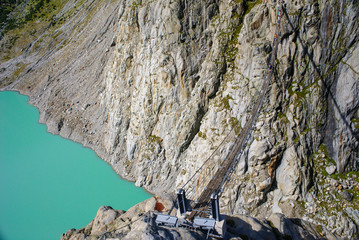 The bridge spans the lake, Triftsee, Switzerland