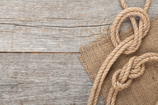 Ship rope on wooden texture background