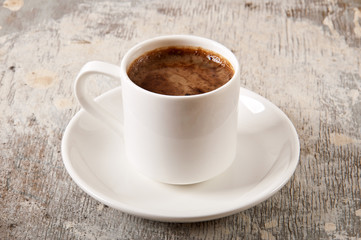 valentines and coffee cup on old wooden background