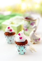 Cupcakes and coffee in Easter or Saint Valentine's Day style