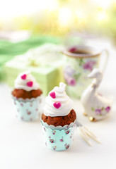 Cupcakes and coffee in Easter or Saint Valentine's Day style