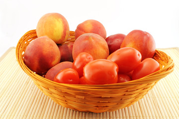 Basket of peaches and tomatoes