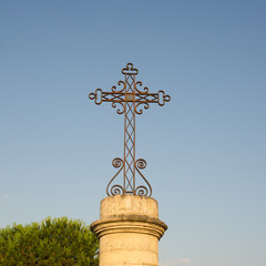 iron cross on stone base
