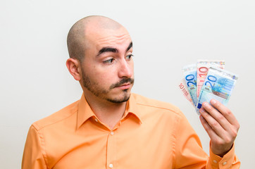 Men portrait with his few dollars left