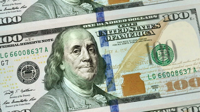 New 100 dollars bill from close-up to sheet