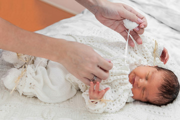 Obraz na płótnie Canvas Dressing up a baby