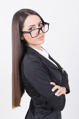 Confident businesswoman with eyeglasses posing with arms crossed
